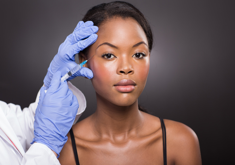 Woman receiving dermal filler injections